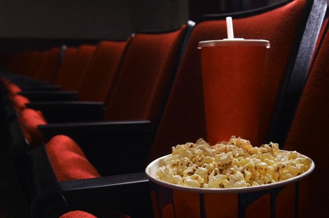 Popcorn and drink in an empty theater